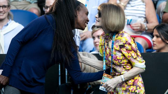 Anna Wintour greets Venus Williams in Serena Williams’s box on Monday. Picture: Tennis Australia