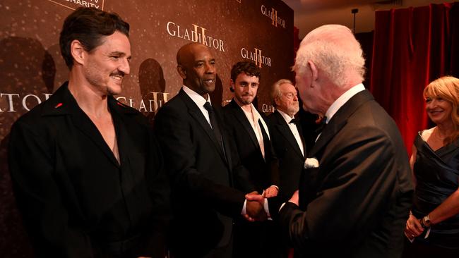 Britain's King Charles III meets US actor Denzel Washington upon arrival for the Royal film performance and World premiere of the film "Gladiator II". Picture: AFP