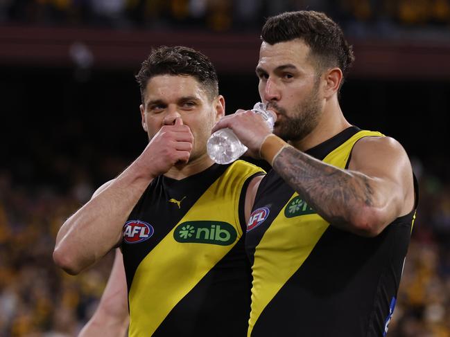 Dion Prestia and Jack Graham leave the field on Sunday. Picture: Darrian Traynor/Getty Images.