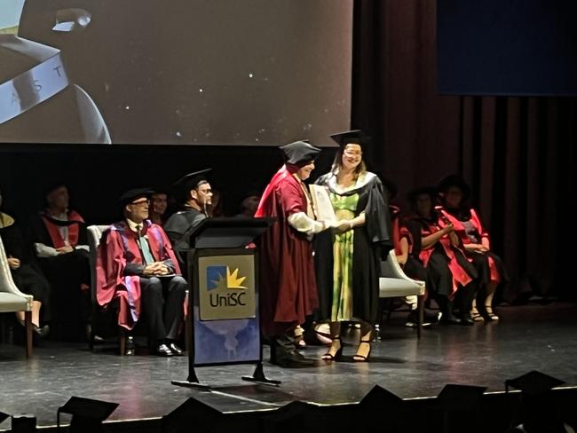 Graduates from the University of the Sunshine Coast's Fraser Coast campus celebrating at the Brolga Theatre.