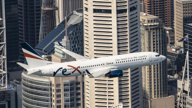 Rex sent its 737 over Sydney's CBD to mark Australia Day 2021 and promote its upcoming flights from Melbourne to the city. Picture: Joe Corrigan