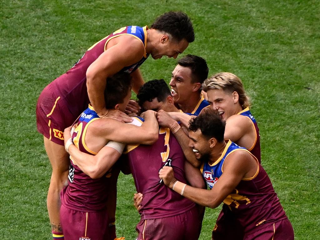 Daniher was mobbed by teammates after kicking Brisbane’s last goal of the grand final. Picture: Adam Trafford/AFL Photos via Getty Images