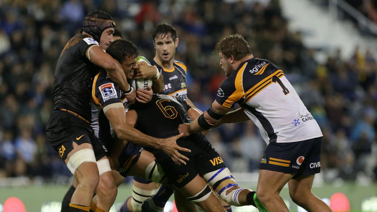 Rory Arnold of the Brumbies is tackled by Pablo Matera of the Jaguares.