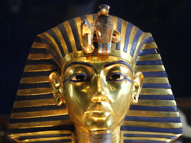 In this 15 Feb 2010 photo, the golden mask of Egypt's famous King Tutankhamun is displayed at the Egyptian museum in Cairo, Egypt. Egypt's famed King Tut suffered from a cleft palate and club foot, likely forcing him to walk with a cane, and died from complications from a broken leg exacerbated by malaria, according to the most extensive study ever of his mummy. (AP Photo/Amr Nabil)