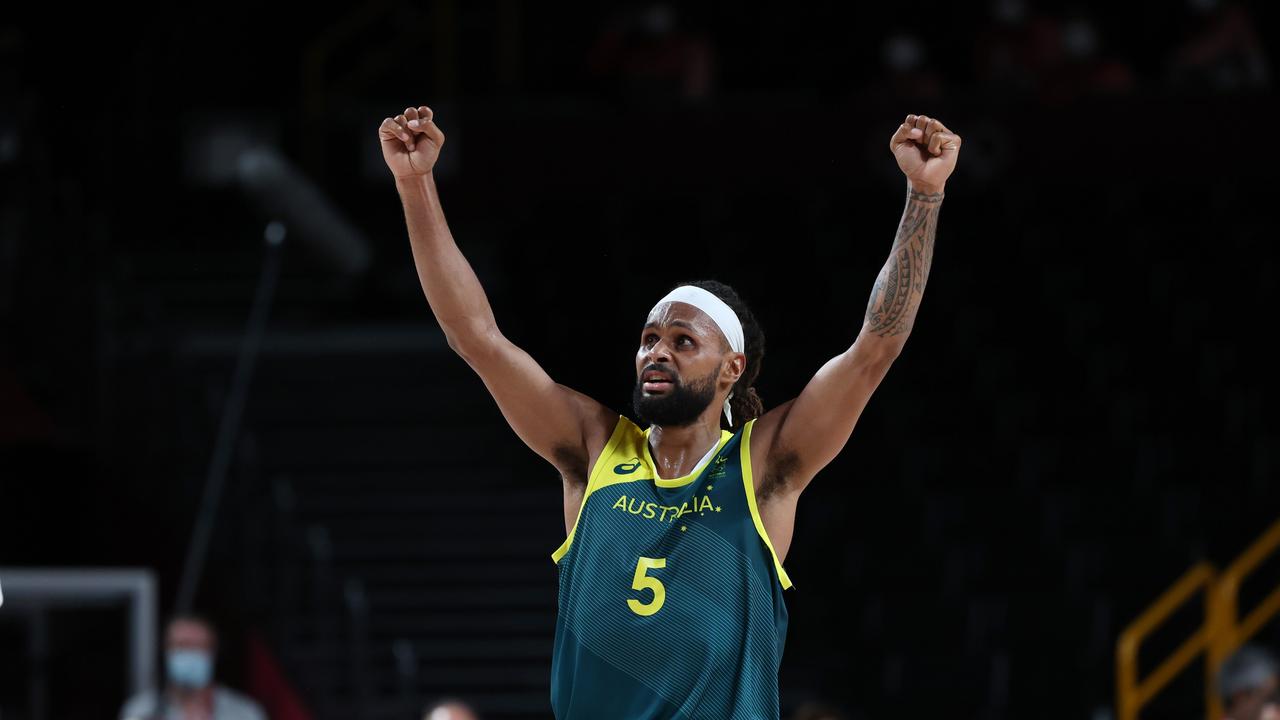 Patty Mills celebrates the milestone win over Slovenia to seal a first-ever medal for the Boomers.