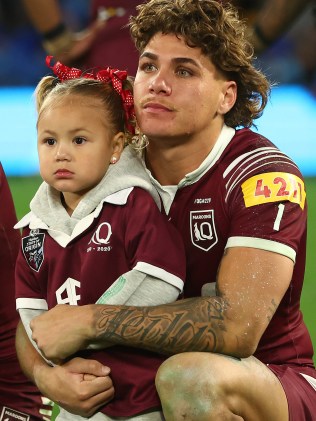 Reece Walsh with his daughter Leila. Photo by Chris Hyde/Getty Images