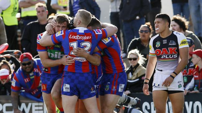 Cory Denniss of the Knights (left) celebrates a first half try during the Round 23 NRL match between the Penrith Panthers and the Newcastle Knights at Panthers Stadium in Sydney, Saturday, August 18, 2018. (AAP Image/Darren Pateman) NO ARCHIVING, EDITORIAL USE ONLY