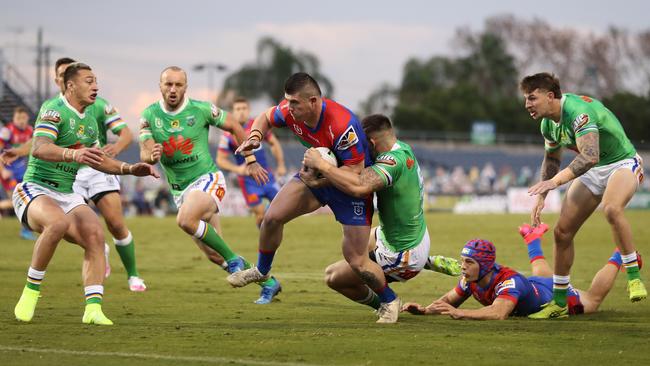 Newcastle’s Bradman Best slices through the Raiders defence to score at Campbelltown Stadium on Sunday. Picture: Getty Images