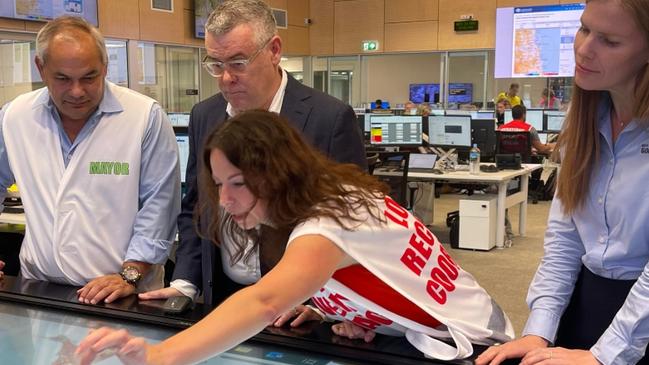 Gold Coast Mayor Tom Tate and Coast-based Senator Murray Watt with acting Local Disaster and Recovery co-ordinator Cath Drinkwater and Acting CEO Alisha Swain looking at impact of ex-Tropical Cyclone Alfred.