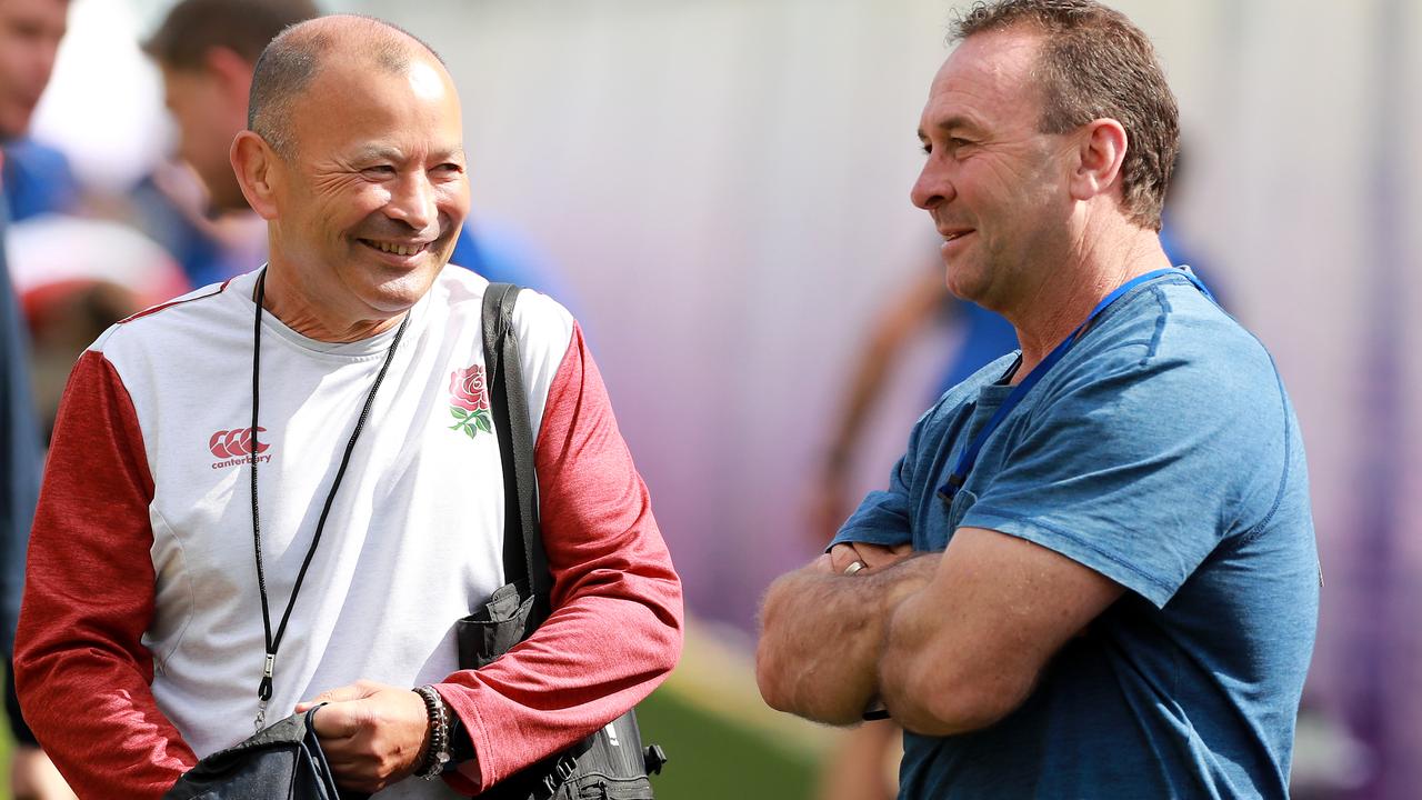 Eddie Jones talks to Ricky Stuart during an England training session in Beppu.