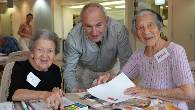 Bill Yeates, of North Curl Curl, with Manly Beachcomber Social Club members Pat Asplin (left) and Jessie Jan (right).