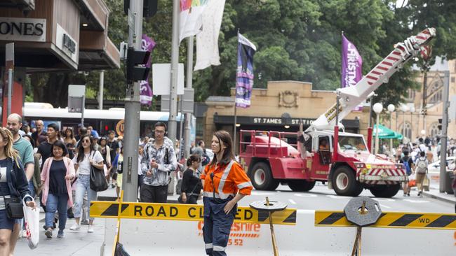 A crane is parked on the corner of Market and Elizabeth streets in Sydney's CBD during the Boxing Day sales. Picture: Jenny Evans