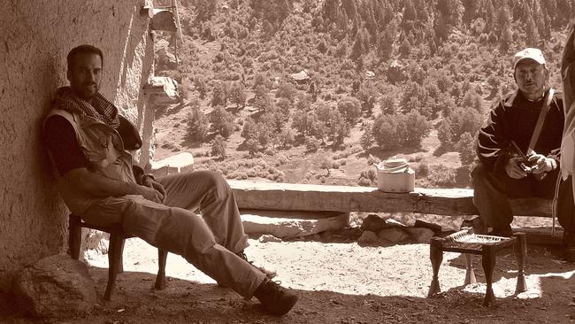 Paul Reeves takes a moment in the shade in Nooristan, Afghanistan in 2005.