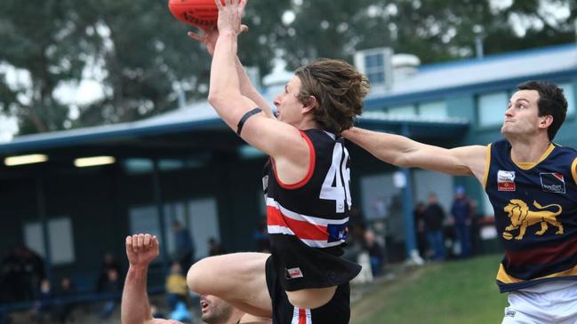 Daniel Gorringe flies for a mark for Park Orchards. Picture: Davis Harrigan