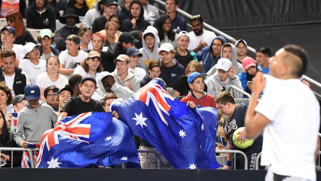 Australian fans watch on as Kyrgios capitulates.