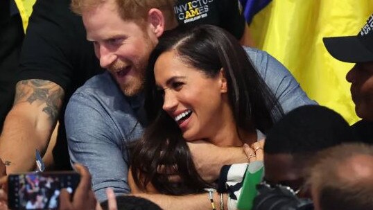 Prince Harry and Meghan Markle put on a loved up display at the Invictus Games. Picture: Supplied