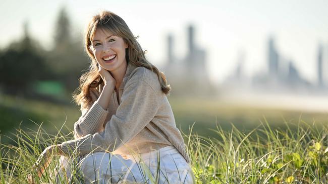 Author Kristina Ross, winner of the 2024 Vogel Prize, on the beach near her home on the Gold Coast. Picture: Lyndon Mechielsen / The Australian