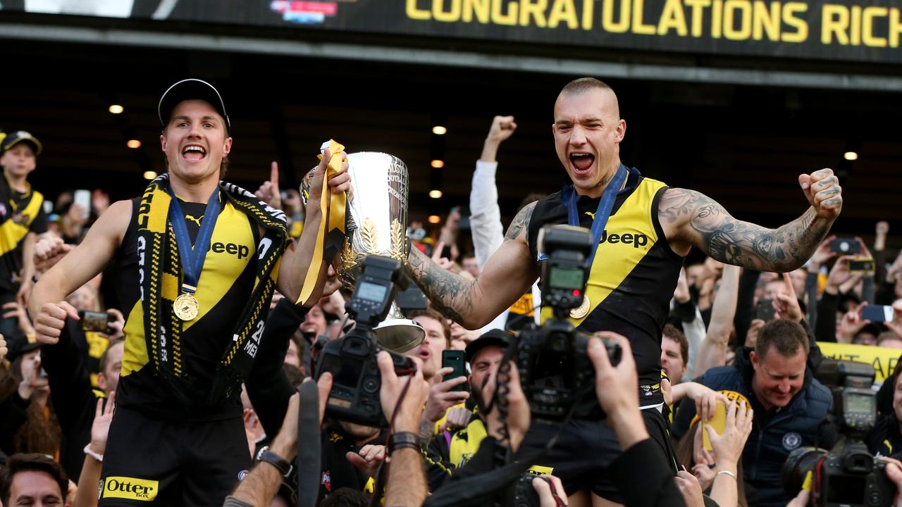 Liam Baker and Dustin Martin with the 2019 premiership cup. Picture: Michael Klein