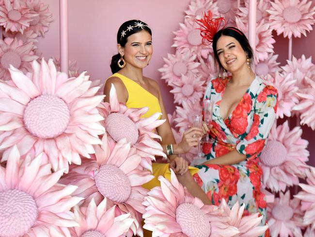 Two punters strike a pose ahead of the Melbourne Cup race. Picture: William West