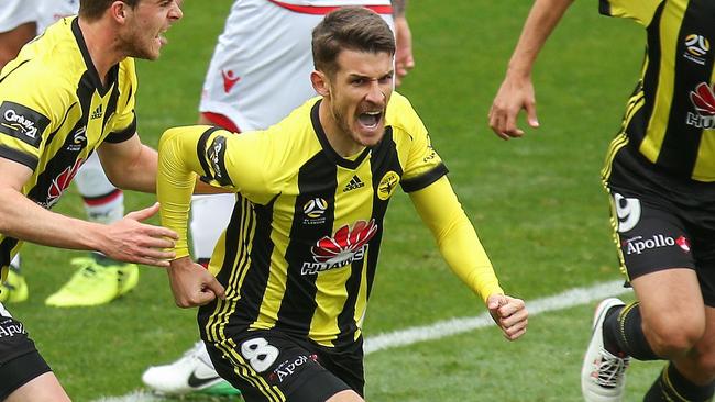 Dario Vidosic celebrates a goal against Adelaide United.