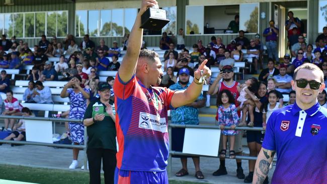 Redbank Plains Bears captain Samson Sauaso raises the trophy after his team won the Rugby League Ipswich Colts grand final. Picture: Bruce Clayton