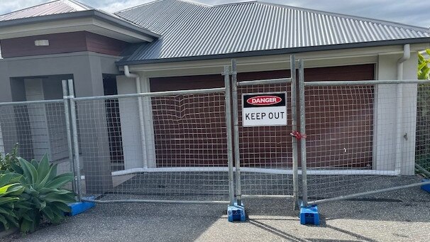 Riverstone Crossing on the Gold Coast - homes boarded up due to a landslip.