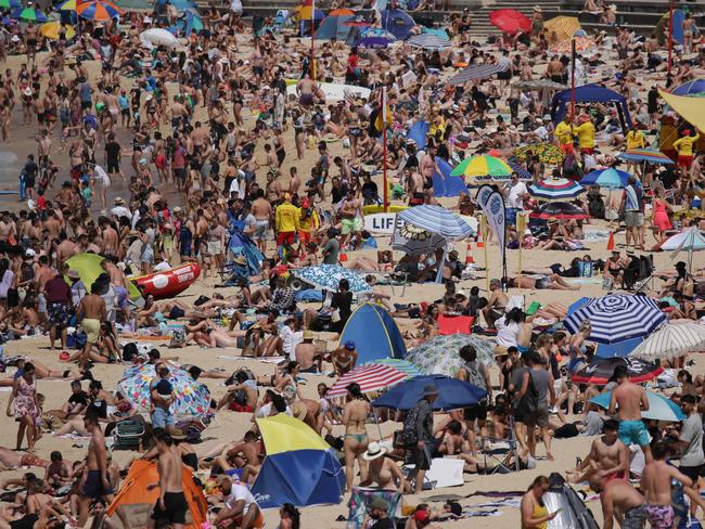 Huge crowds have flocked to Coogee Beach on Monday. Picture: NCA NewsWire / Christian Gilles