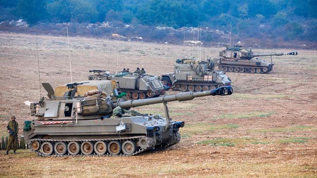 Israeli soldiers armed with artillery cannons man their position at an undisclosed location in northern Israel bordering Lebanon, as fighting between Israeli forces and the Palestinian militant group Hamas raged on October 8, 2023. Picture: AFP