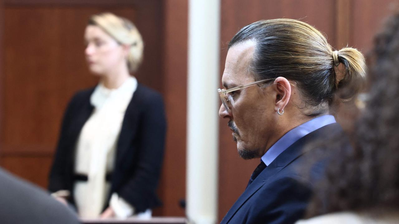 Depp sits in court as his ex-wife takes the stand. Picture: AFP