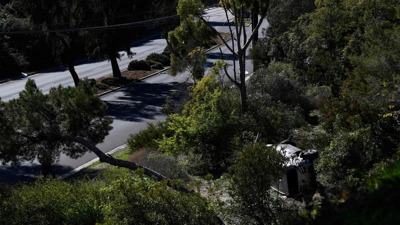 Tiger Woods’ vehicle lies on its side in Rancho Palos Verdes, California, after the golfing great rolled down an embankment. Picture: Patrick T. Fallon AFP