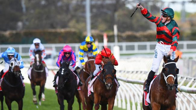 James McDonald celebrates as The Autumn Sun takes out the Caulfield Guineas.