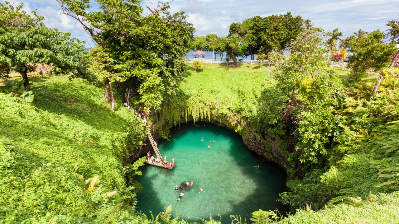 <h2>2. It also has some of the world's most stunning natural swimming holes</h2>
<p>The To-Sua Ocean Trench on the island of Upolu is one of the nation's most popular tourist attractions.</p>