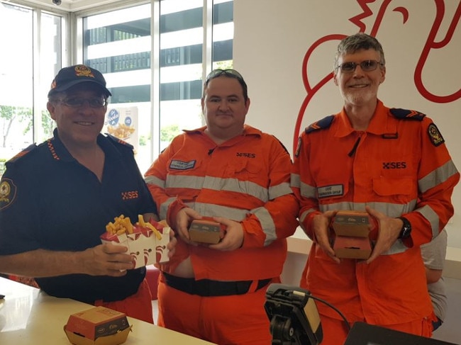 The Red Rooster burgers being sampled in North Queensland after the recent floods that hit Townsville. Picture: Supplied