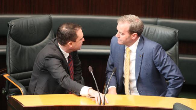 Scott Bacon, left, and Michael Ferguson discuss an allegedly offensive term used during Question Time.