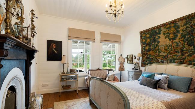 An original fireplace in one of the three bedrooms.