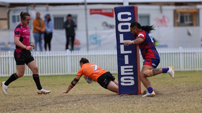 Cameron Williams scores for The Oaks Tigers against Campbelltown Collegians. Picture: Steve Montgomery