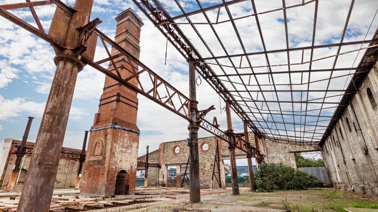 Heritage structures at the former Brompton gasworks site including the Retort House, a chimney, and a bluestone wall on Chief St. Supplied by Renewal SA