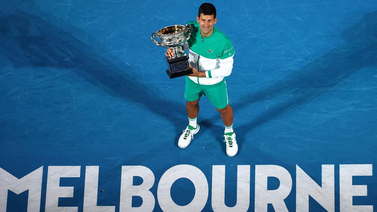 World number one Novak Djokovic said on January 4, 2022 that he was heading to the Australian Open to defend his title after being granted a medical exemption to play. (Photo by Patrick HAMILTON / AFP)