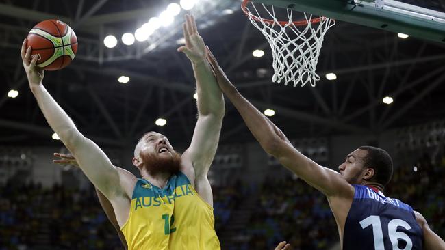 Aron Baynes shoots over France's Rudy Gobert.