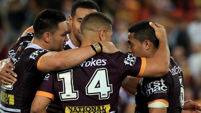 Anthony Milford and his Broncos teammates celebrates their win over the Panthers. Picture: Adam Head