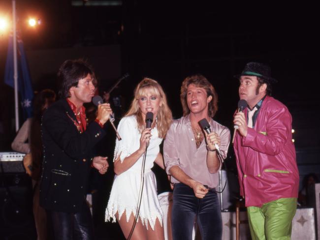 Newton-John onstage in California in 1980 with Cliff Richard, Andy Gibb and Elton John. Picture: Getty Images