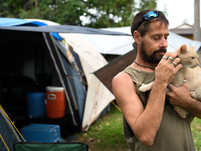 BRISBANE, AUSTRALIA - NewsWire Photos - MARCH 5, 2024.Zane McGill, who is homeless, is photographed with his cat TahZan outside his tent at a park in Rothwell in BrisbaneÃs north, where he has lived in the past 12 months. The suburb is in Premier Steven MilesÃ electorate of Murrumba.Picture: Dan Peled / NCA NewsWire