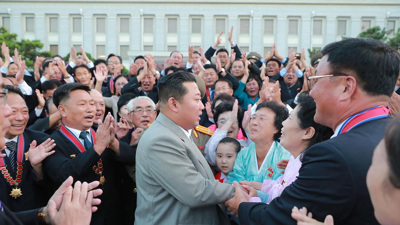 Kim Jong-un meeting with North Korean citizens, with not a mask in sight. Picture: AFP PHOTO/KCNA VIA KNS