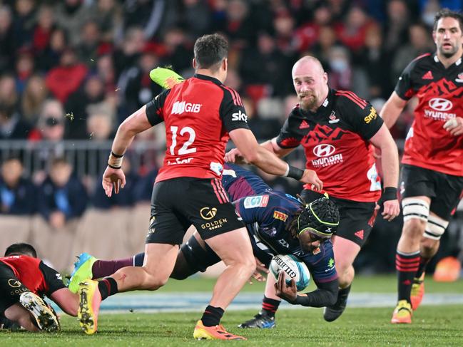 Reds forward Seru Uru is tackled during Queensland’s loss to the Crusaders. Picture: Kai Schwoerer/Getty Images