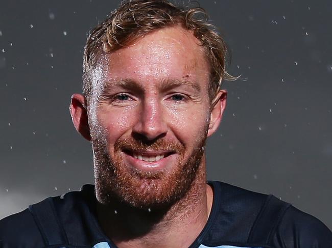 NSW's Matt Prior poses for a portrait in the rain after NSW State of Origin training at Moore Park, Sydney. Picture: Brett Costello