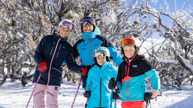 Tourists (from left) Christie Hampton and Jono Brauer with children Lilly Brauer and Ashleigh Hampton take advantage of good falls skiing at Thredbo Resort. Picture: Thredbo Resort