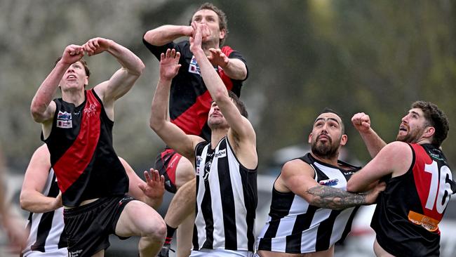 Riddell and Wallan players fly for the ball. Picture: Andy Brownbill