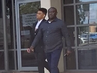 Shadrack Agboma (left) leaving court with his father on Monday. Picture: Lauren Ferri