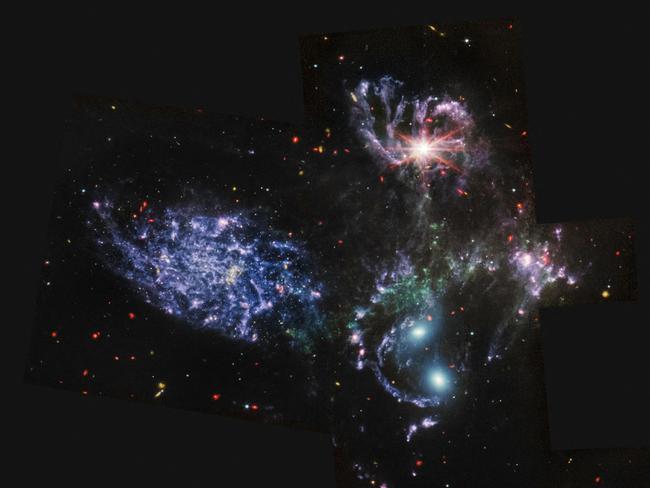 This image released by NASA on July 12, 2022, from the Mid-Infrared Instrument (MIRI) on the James Webb Space Telescope (JWST) shows never-before-seen details of Stephanâs Quintet, a visual grouping of five galaxies. MIRI pierced through dust-enshrouded regions to reveal huge shock waves and tidal tails, gas and stars stripped from the outer regions of the galaxies by interactions. It also unveiled hidden areas of star formation. The new information from MIRI provides invaluable insights into how galactic interactions may have driven galaxy evolution in the early universe. - The JWST is the most powerful telescope launched into space and it reached its final orbit around the sun, approximately 930,000 miles from Earths orbit, in January, 2022. The technological improvements of the JWST and distance from the sun will allow scientists to see much deeper into our universe with greater detail. (Photo by Handout / NASA / AFP) / RESTRICTED TO EDITORIAL USE - MANDATORY CREDIT "AFP PHOTO / NASA" - NO MARKETING NO ADVERTISING CAMPAIGNS - DISTRIBUTED AS A SERVICE TO CLIENTS