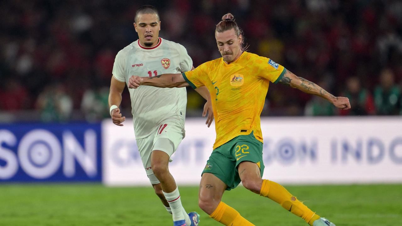 Socceroos midfielder Jackson Irvine (right) gets the better of Indonesia's Ragnar Oratmangoen in a 0-0 draw in Jakarta. Picture: Bay Ismoyo / AFP